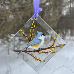 "Hand-painted Tufted Titmouse suncatcher, vibrant glass art hanging in a window. Perfect for bird lovers and nature-inspired home decor."